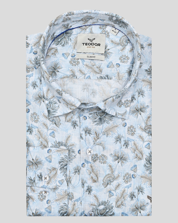 СИНЯ РИЗА С НАВИВАЩИ СЕ РЪКАВИ В КОНТРАСТЕН ФЛОРАЛЕН ДЕСЕН 