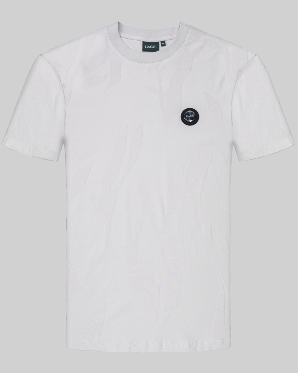 СВЕТЛОСИВА РЕЛЕФНА ТЕНИСКА С ГУМЕН БАДЖ И ЕЛАСТАН