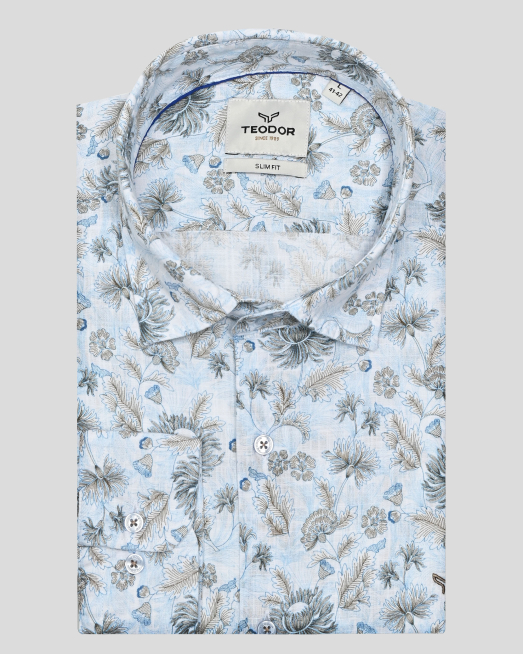 'СИНЯ РИЗА С НАВИВАЩИ СЕ РЪКАВИ В КОНТРАСТЕН ФЛОРАЛЕН ДЕСЕН 